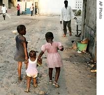 Children walk down a street in the city of Kinshasa, Congo, 31 Oct 2006
