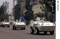 UN troops in armored vehicles drive through the streets of Kinshasa, Congo